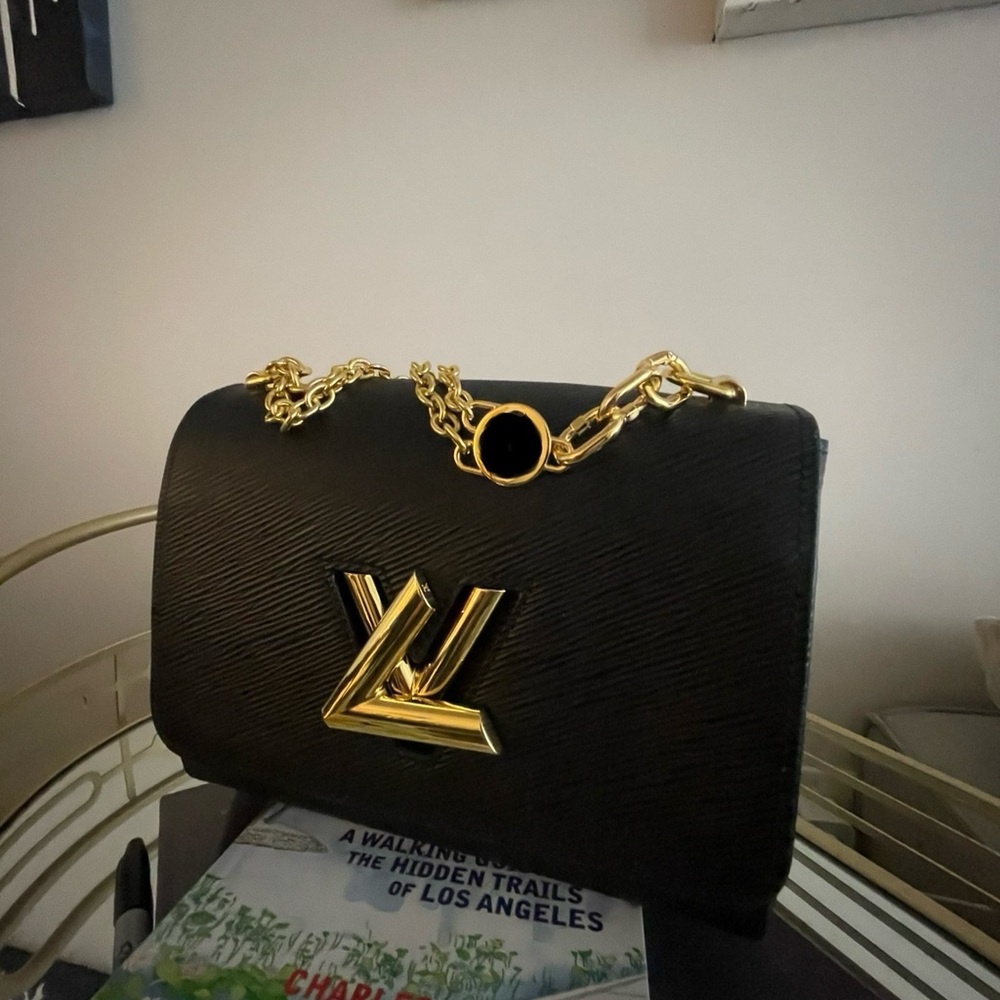 leather twist lock black and gold crossbody or handbag